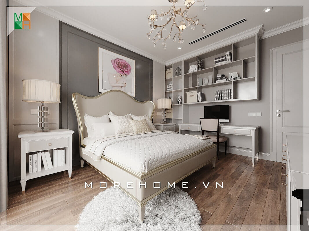 Có lẽ điểm nổi bật nhất trong căn phòng ngủ chung cư đẹp chính là cái giường ngủ mang đậm chất tân cổ điển thiết kế đầu giường uốn lượn mềm mại. Nội thất trong phòng ngủ như kệ giá sách, bàn làm việc, tranh canvas treo đầu giường đến từng chi tiết nhỏ như đèn ngủ hay đèn treo trần tất cả đều sắp xếp rất ngăn nắp và hợp lý. Mẫu nội thất chung cư tân cổ điển